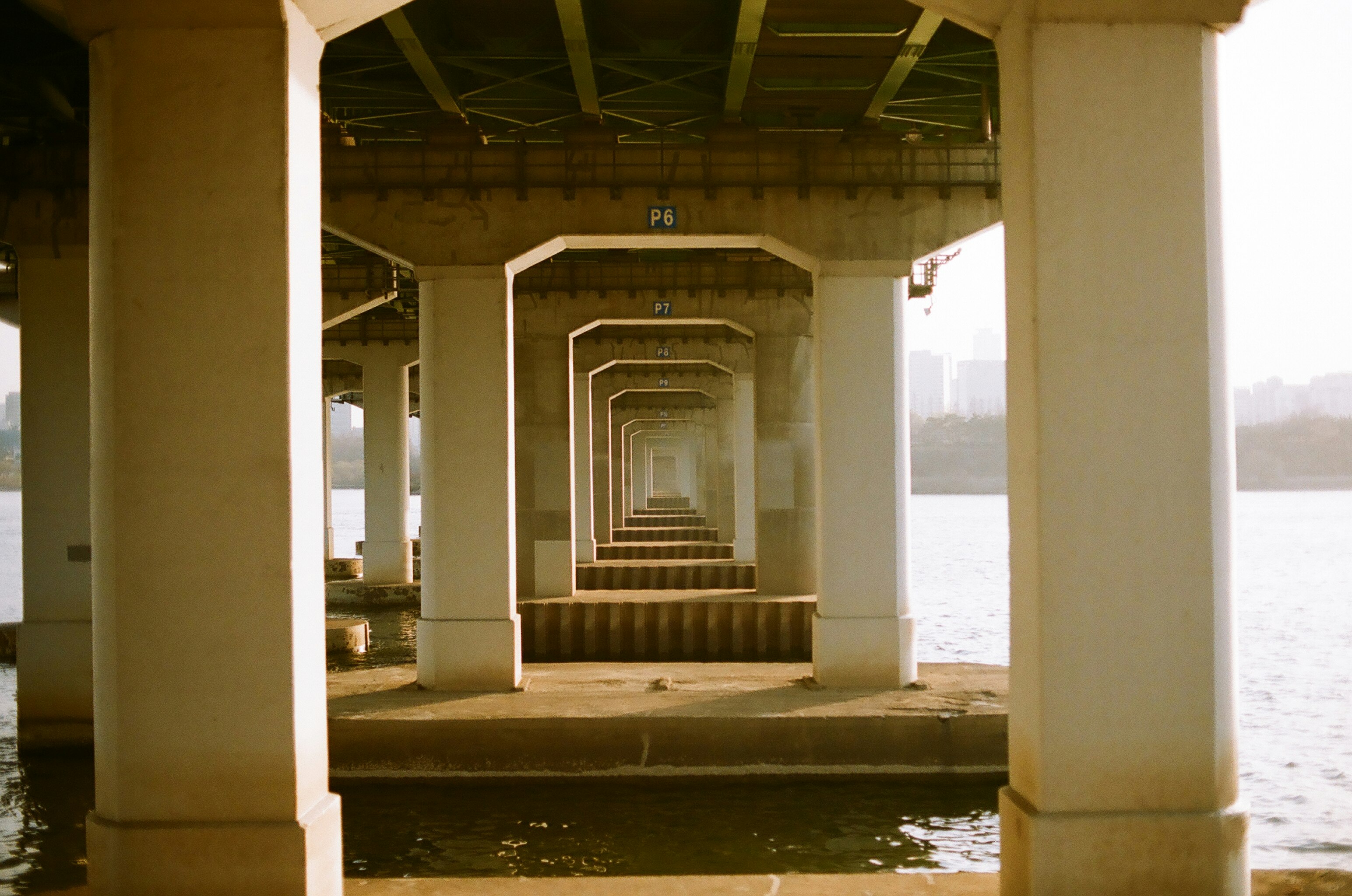 white concrete building near body of water during daytime